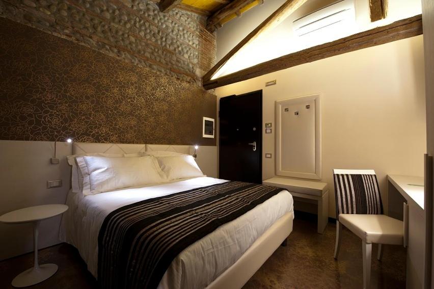 Postel nebo postele na pokoji v ubytování Villa Solaris Hotel & Residence