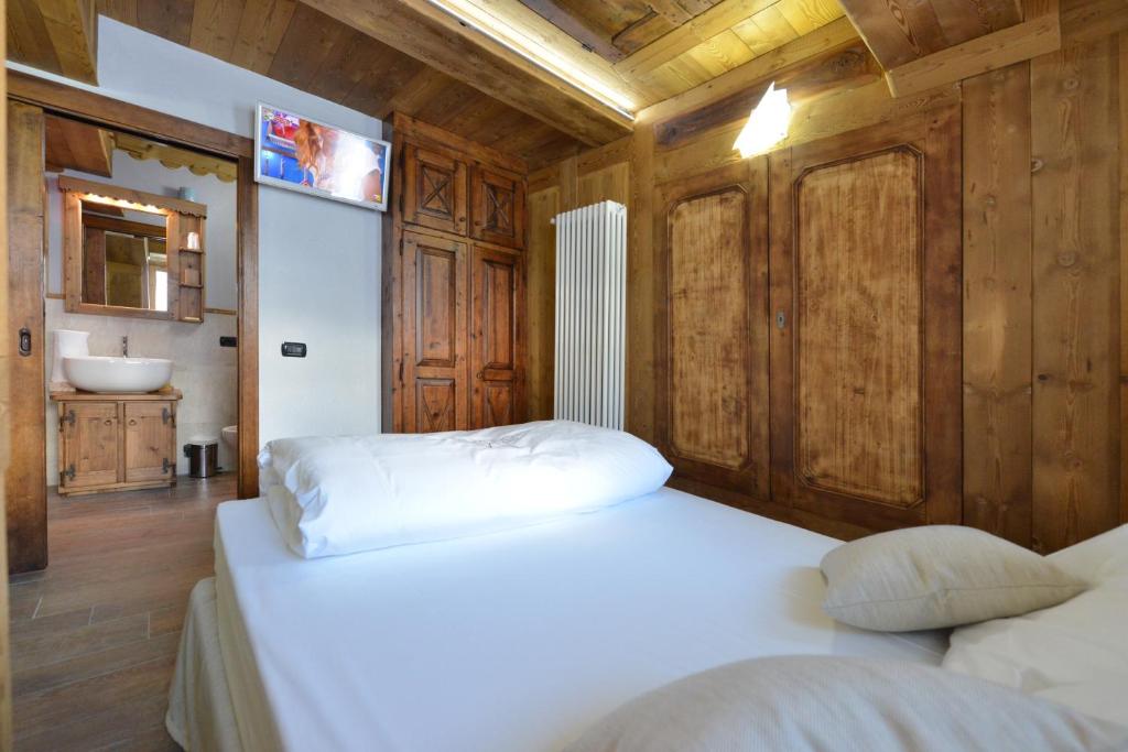Łóżko lub łóżka w pokoju w obiekcie Mollino Rooms