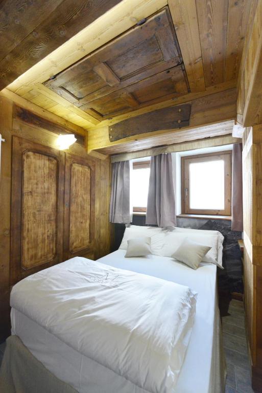Łóżko lub łóżka w pokoju w obiekcie Mollino Rooms