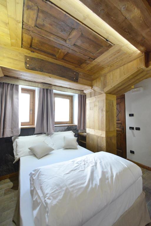 Łóżko lub łóżka w pokoju w obiekcie Mollino Rooms