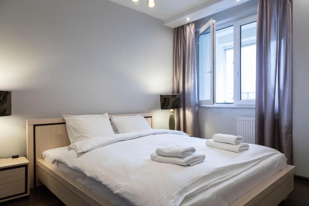 Posteľ alebo postele v izbe v ubytovaní Apartament Moniuszki by Your Freedom