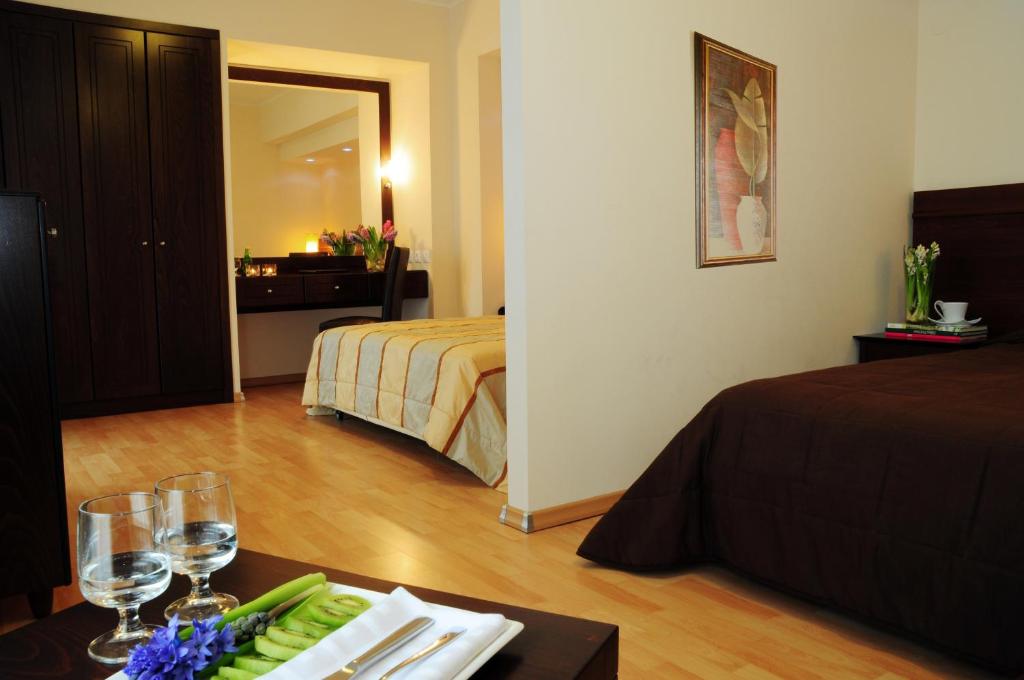 Postel nebo postele na pokoji v ubytování Flisvos Hotel Nafpaktos