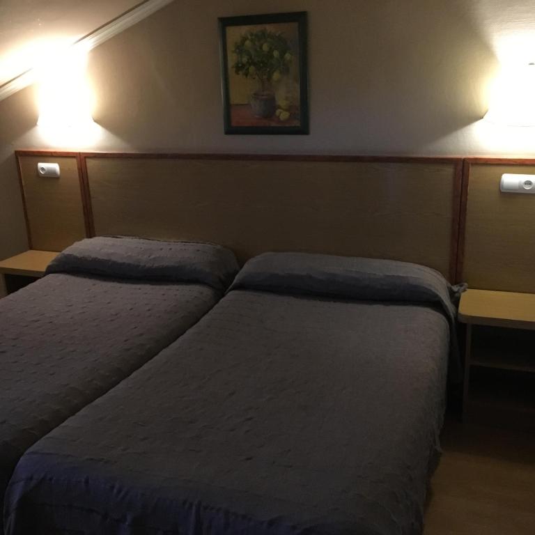 Postel nebo postele na pokoji v ubytování Hotel Avenida Leganés