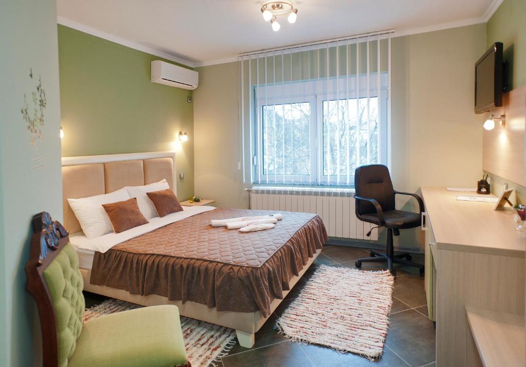 Postel nebo postele na pokoji v ubytování Garni Hotel Lama