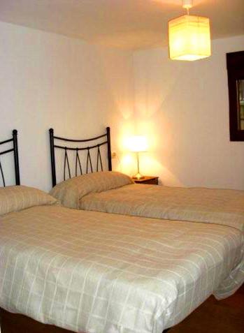 Postel nebo postele na pokoji v ubytování Apartamentos Valdelinares