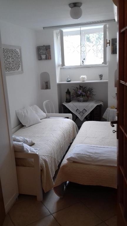 Postel nebo postele na pokoji v ubytování Villa Apollo B&B