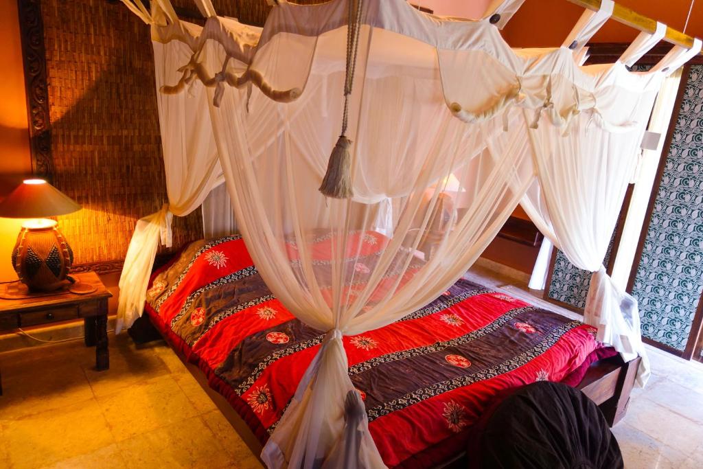 Postel nebo postele na pokoji v ubytování Medana Resort Lombok