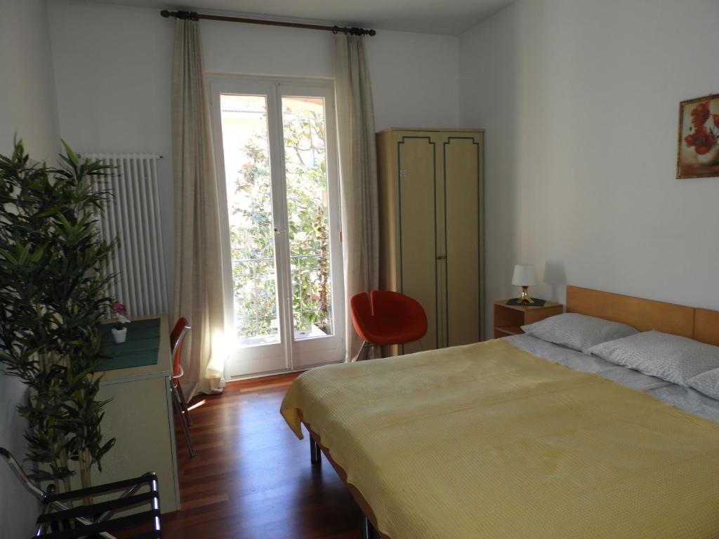 Postel nebo postele na pokoji v ubytování Rooms Al Festival