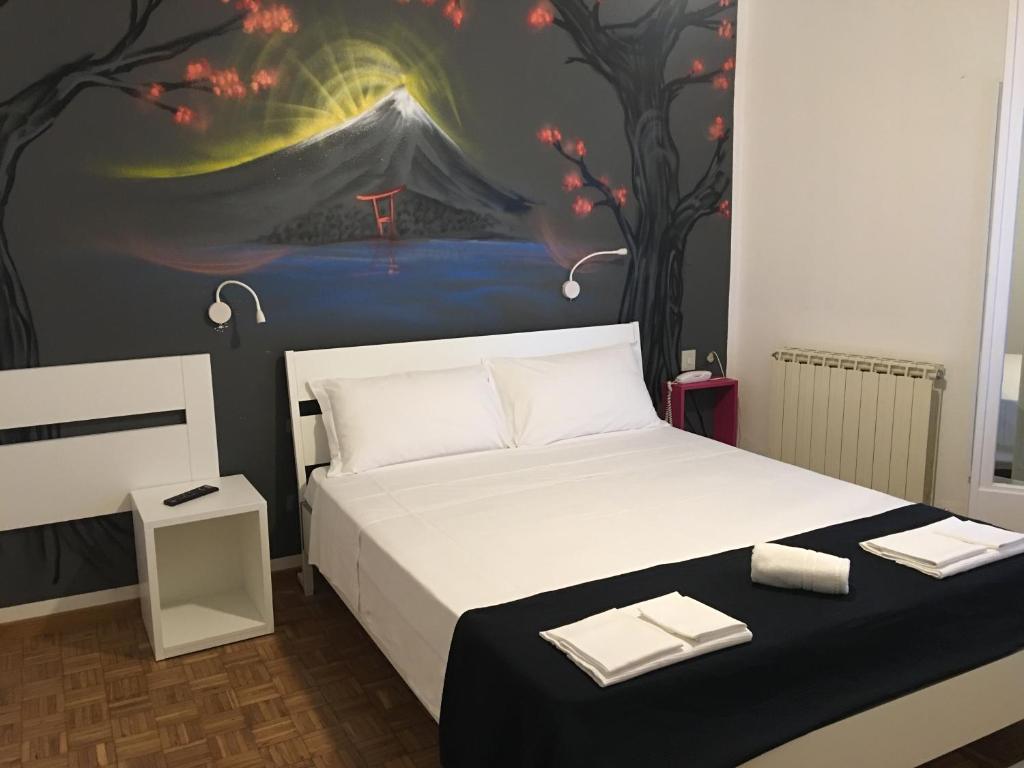 Postel nebo postele na pokoji v ubytování X Hotel