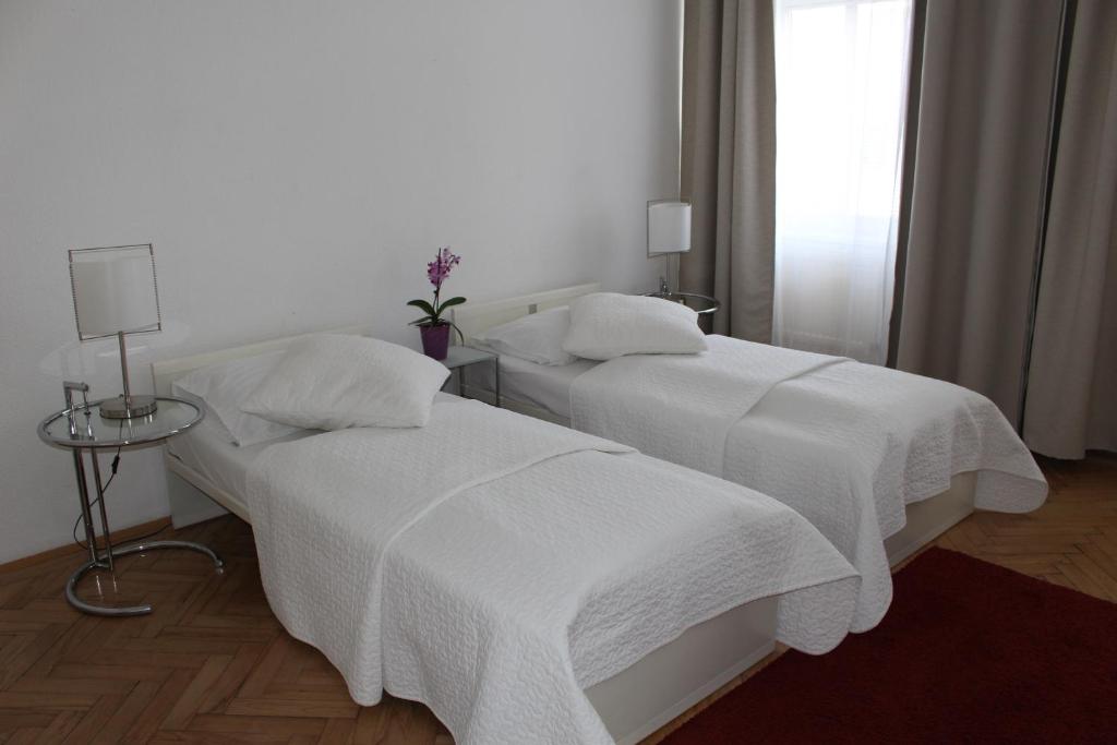 Postel nebo postele na pokoji v ubytování Hotel Wiener Kindl
