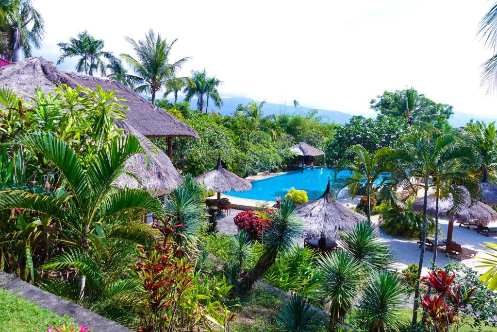 an aerial view of a resort with a swimming pool at Medana Resort Lombok in Tanjung