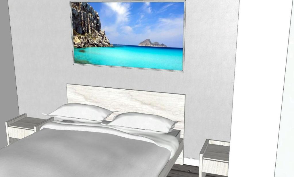 a bedroom with a bed with a view of the ocean at B&B Marconi in Favignana