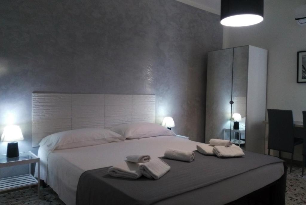 Postel nebo postele na pokoji v ubytování ALGHERO SEASIDE Guest House - Affittacamere