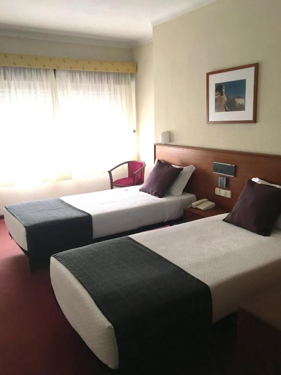 Uma cama ou camas num quarto em Hotel Umu