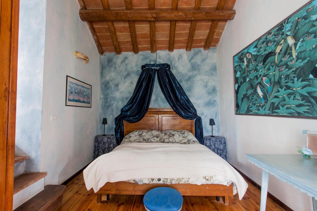 Postel nebo postele na pokoji v ubytování Relais I Castagnoni