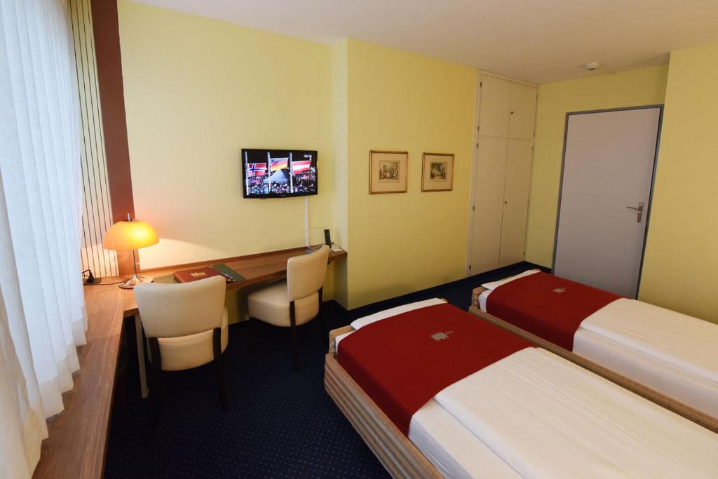 Voodi või voodid majutusasutuse Hotel Dufour toas