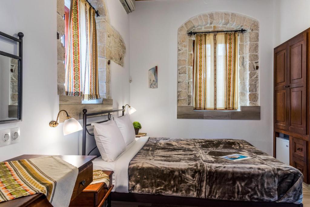 Postel nebo postele na pokoji v ubytování Cretan Villa Hotel