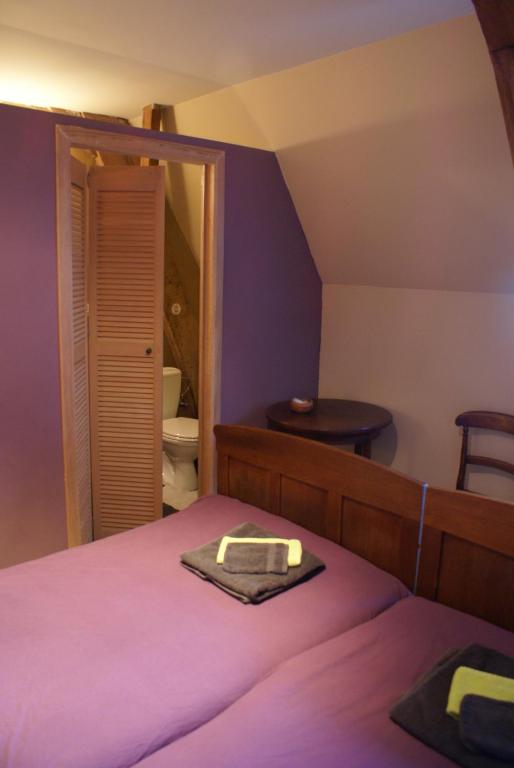 Postel nebo postele na pokoji v ubytování B&B De Metstermolen