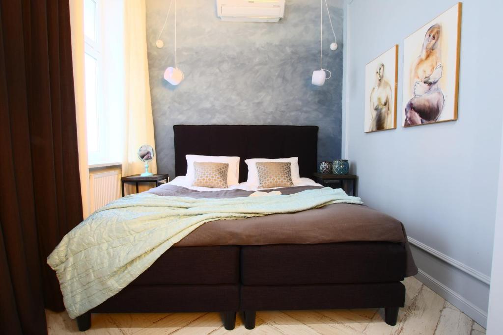 Łóżko lub łóżka w pokoju w obiekcie Apartamenty Batorego 2 - Stary Rynek