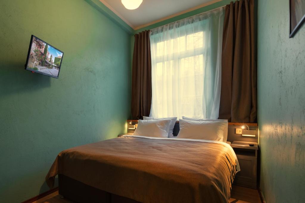 Postel nebo postele na pokoji v ubytování Kindli Boutique Hotel