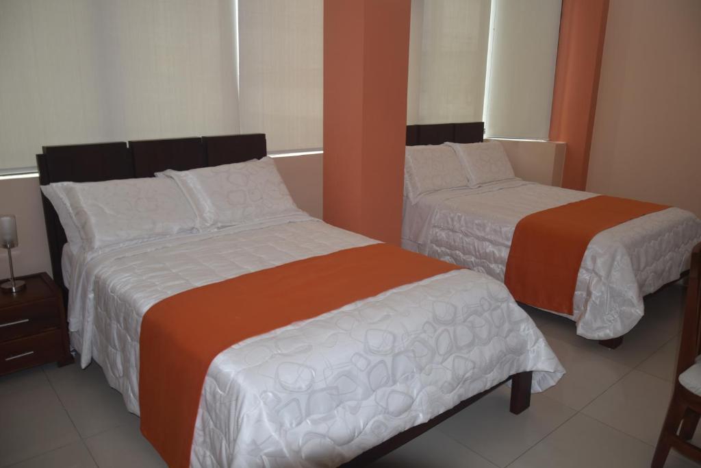 Postel nebo postele na pokoji v ubytování Olan´s Hotel Group