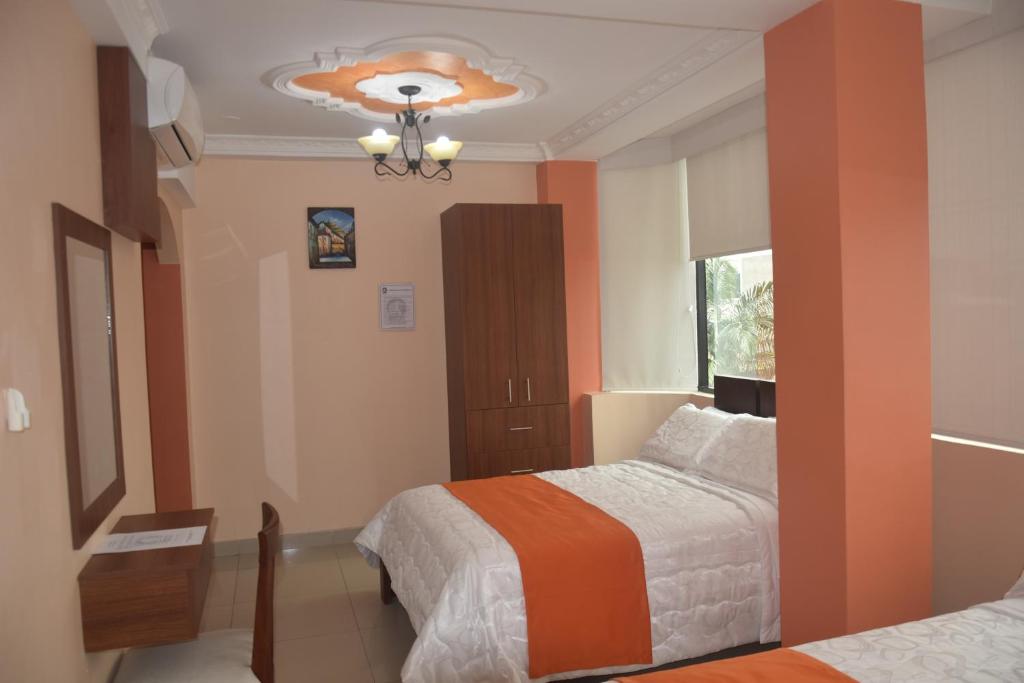 Postel nebo postele na pokoji v ubytování Olan´s Hotel Group