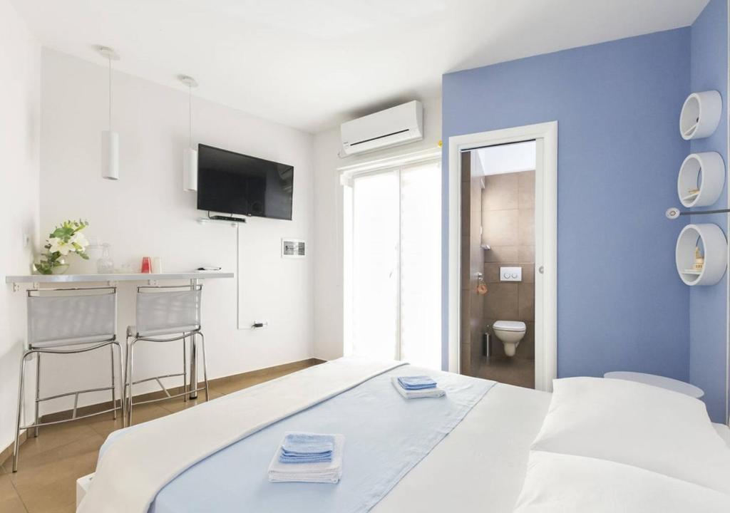 Postel nebo postele na pokoji v ubytování Guest House Varos