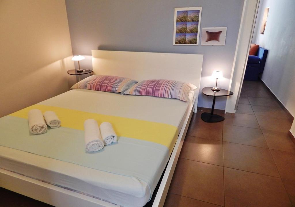 Postel nebo postele na pokoji v ubytování Guest House Varos