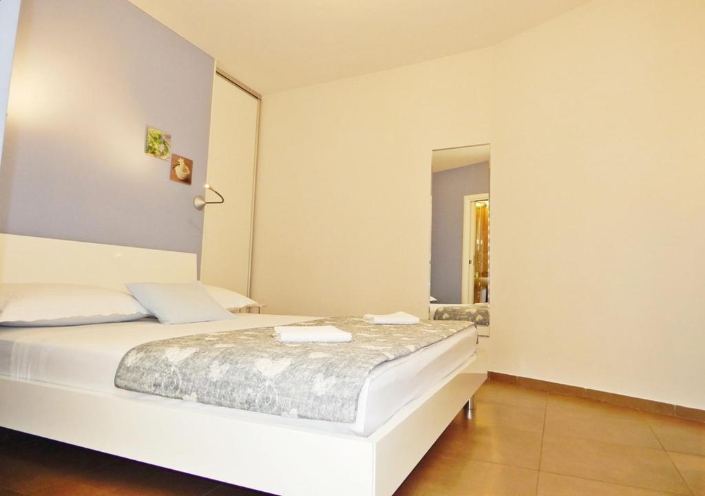 Postel nebo postele na pokoji v ubytování Guest House Varos
