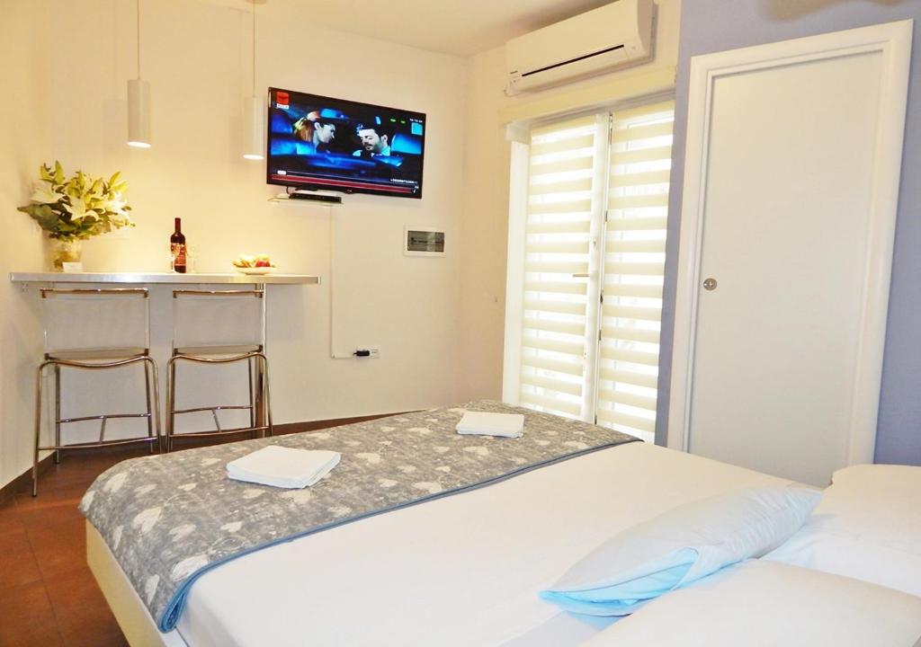 Postel nebo postele na pokoji v ubytování Guest House Varos