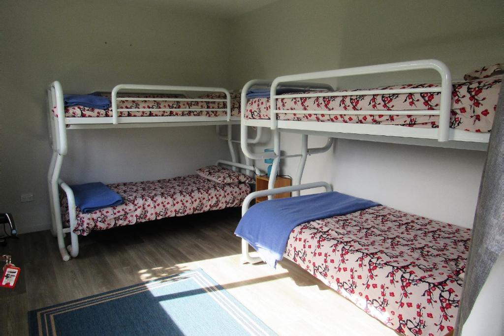 Postel nebo postele na pokoji v ubytování White Elephant Accomodation