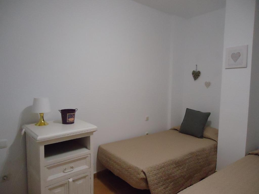 A bed or beds in a room at Apartamento Céntrico Lobos
