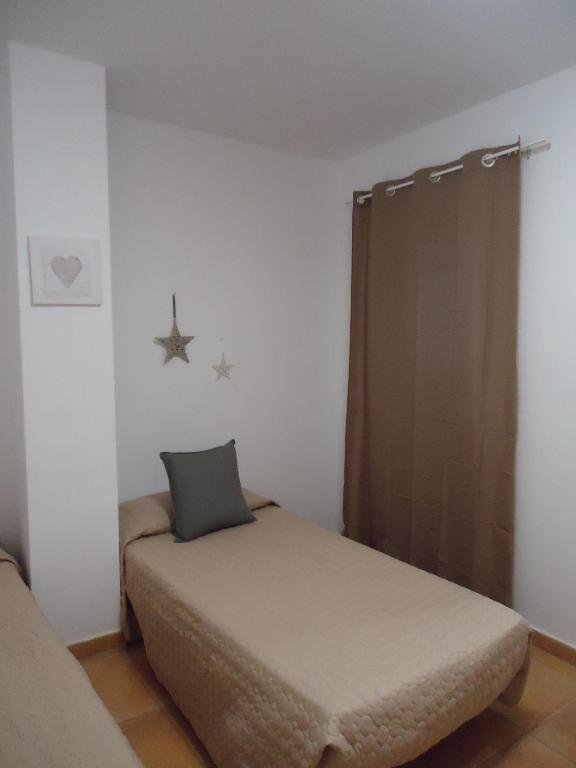 A bed or beds in a room at Apartamento Céntrico Lobos