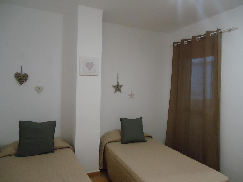 A bed or beds in a room at Apartamento Céntrico Lobos