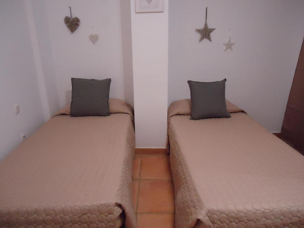 A bed or beds in a room at Apartamento Céntrico Lobos