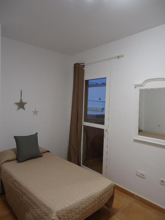 A bed or beds in a room at Apartamento Céntrico Lobos