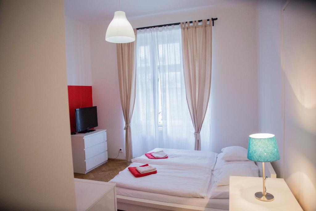 Postel nebo postele na pokoji v ubytování Budget Apartment