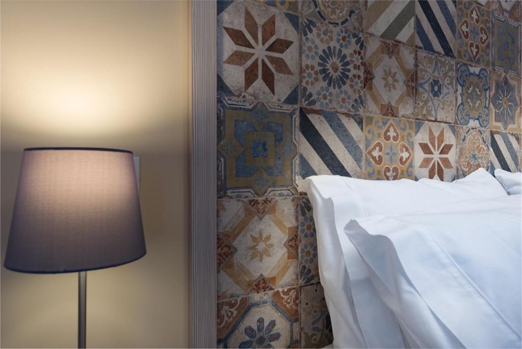 Posteľ alebo postele v izbe v ubytovaní Doride b&b