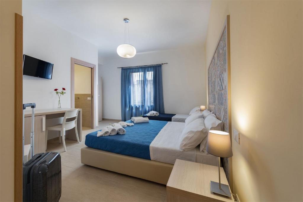 Posteľ alebo postele v izbe v ubytovaní Doride b&b