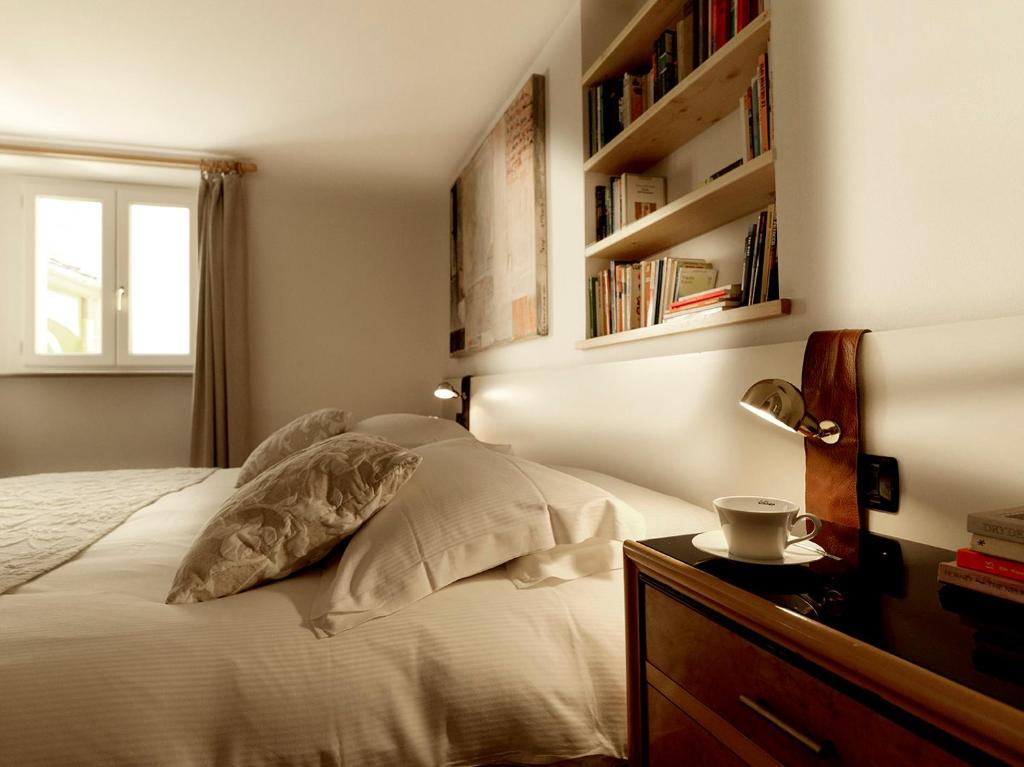 Postel nebo postele na pokoji v ubytování Boutique Hotel Albero Nascosto
