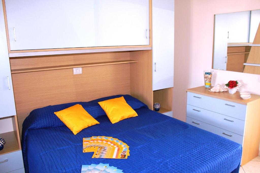 A bed or beds in a room at Airone Bianco Residence Village