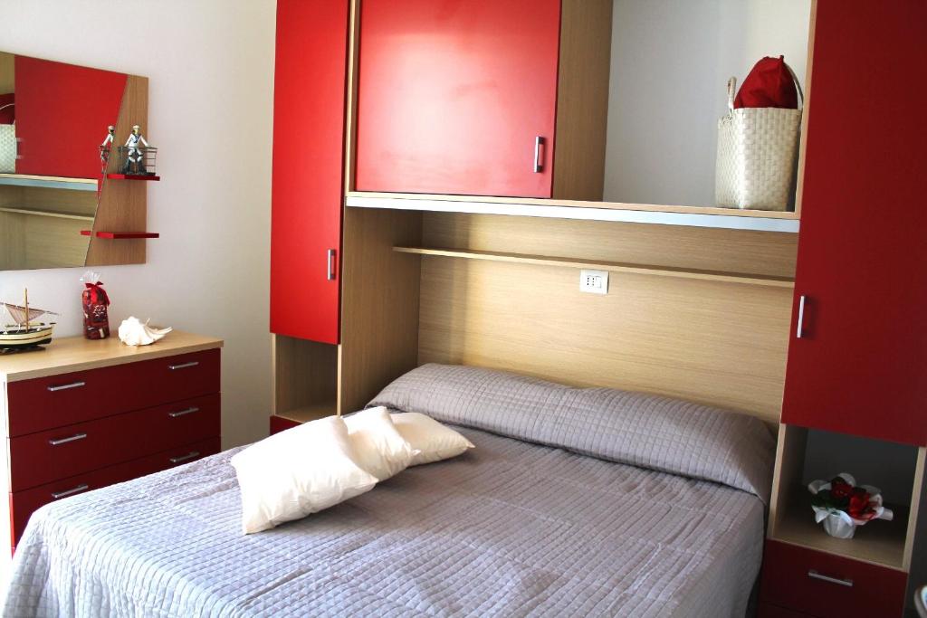 A bed or beds in a room at Airone Bianco Residence Village