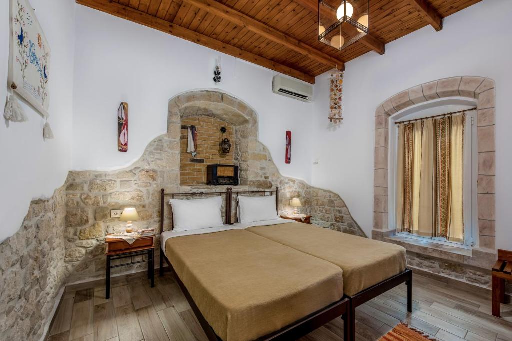 Postel nebo postele na pokoji v ubytování Cretan Villa Hotel