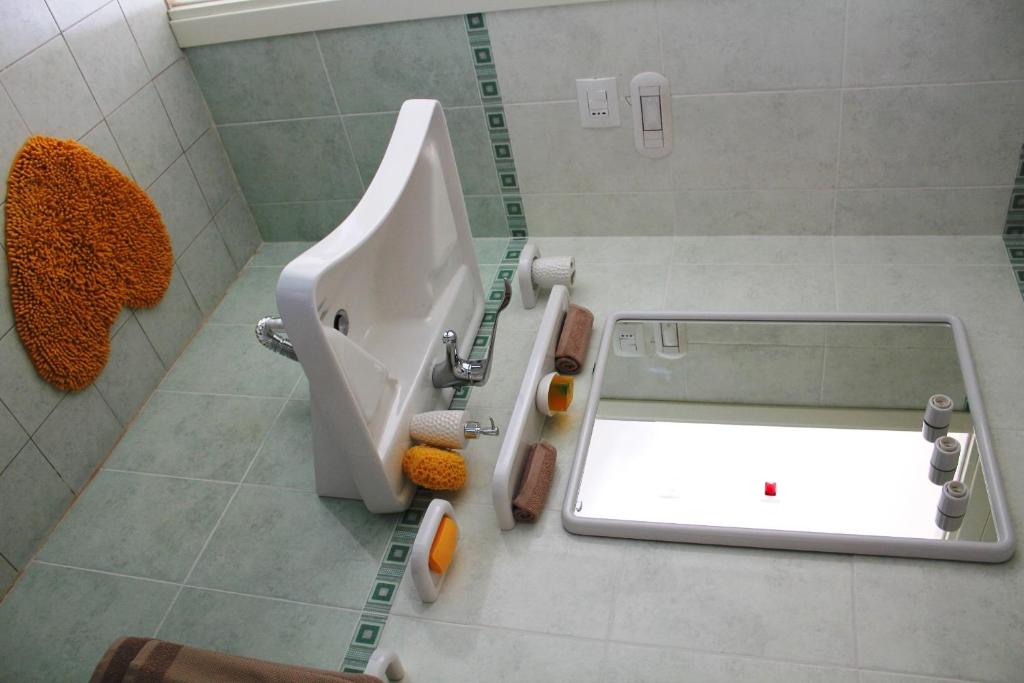 A bathroom at Airone Bianco Residence Village
