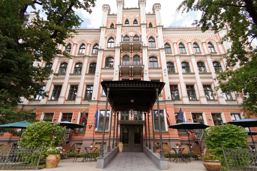 a large building with a door in front of it at Monika Centrum Hotels in Riga