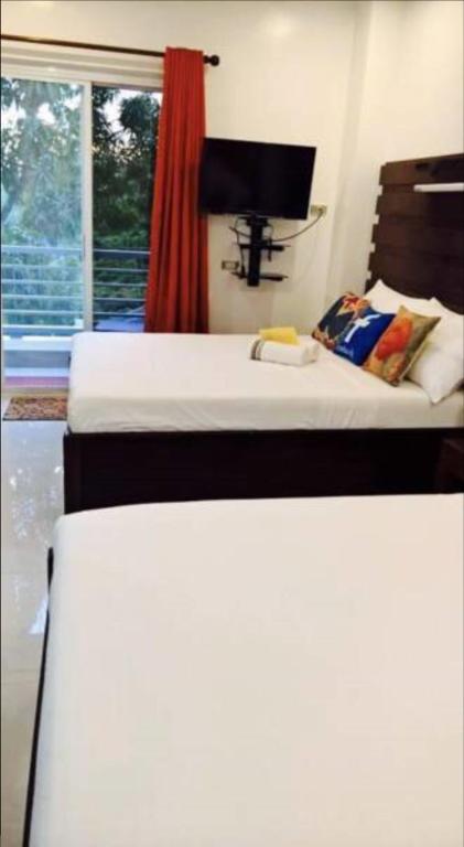 Postel nebo postele na pokoji v ubytování SunValley Tourist Inn