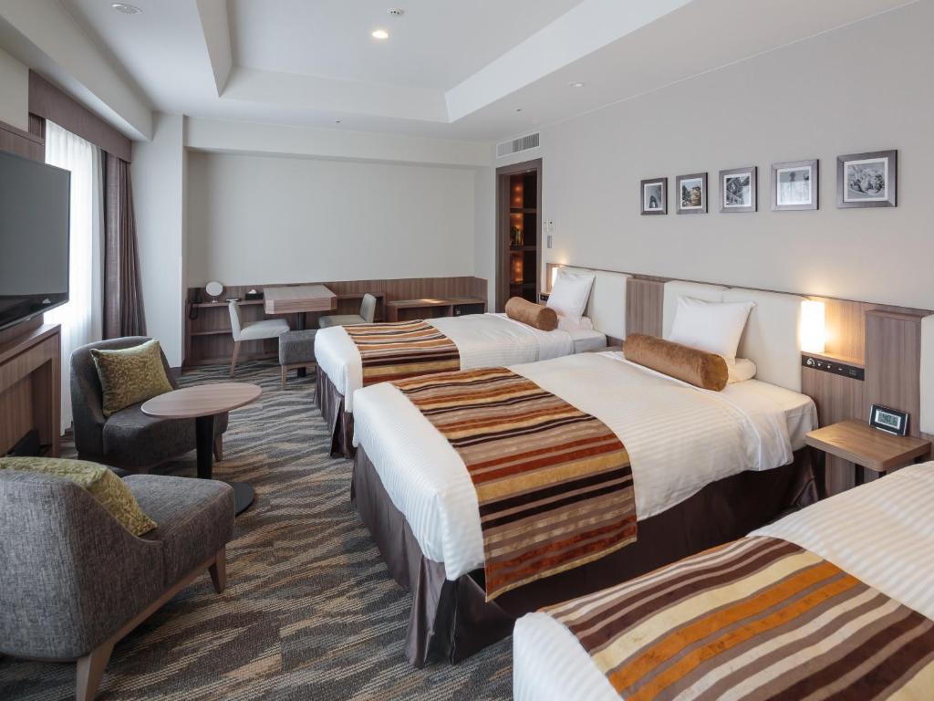 Postel nebo postele na pokoji v ubytování Hotel MYSTAYS PREMIER Dojima