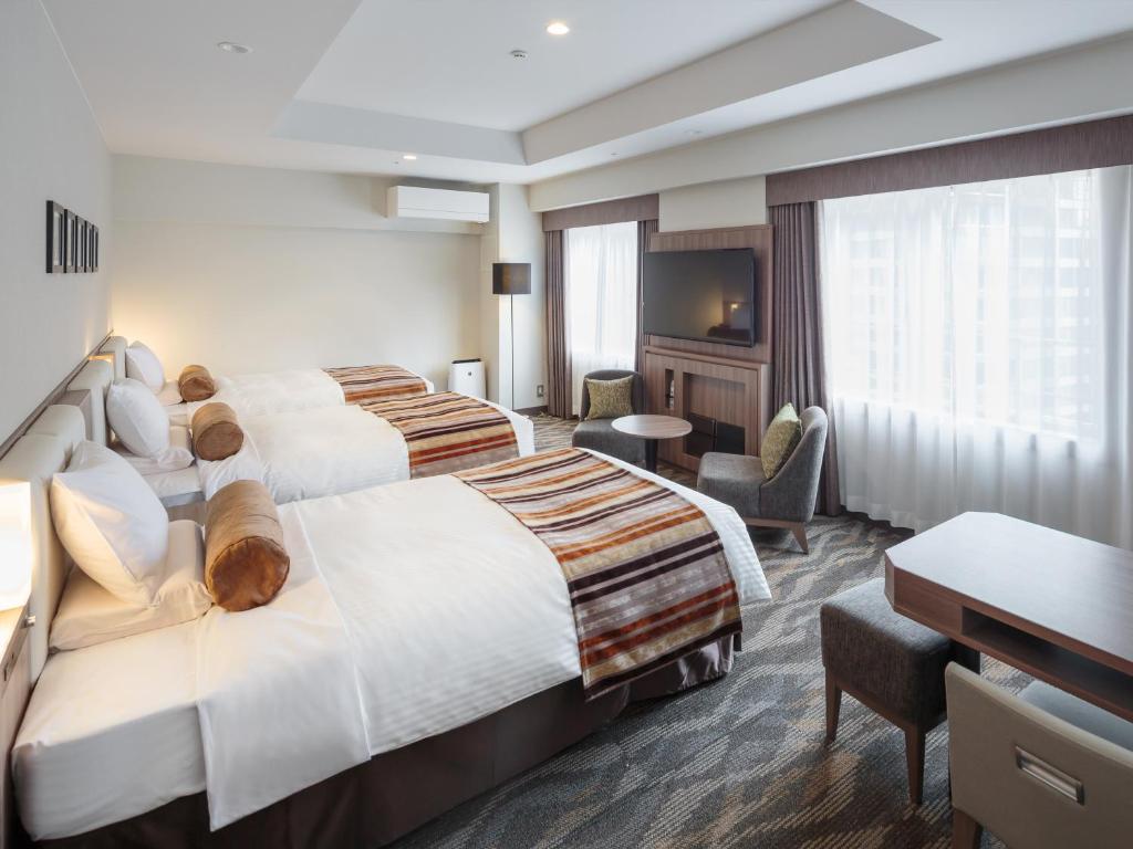 Postel nebo postele na pokoji v ubytování Hotel MYSTAYS PREMIER Dojima