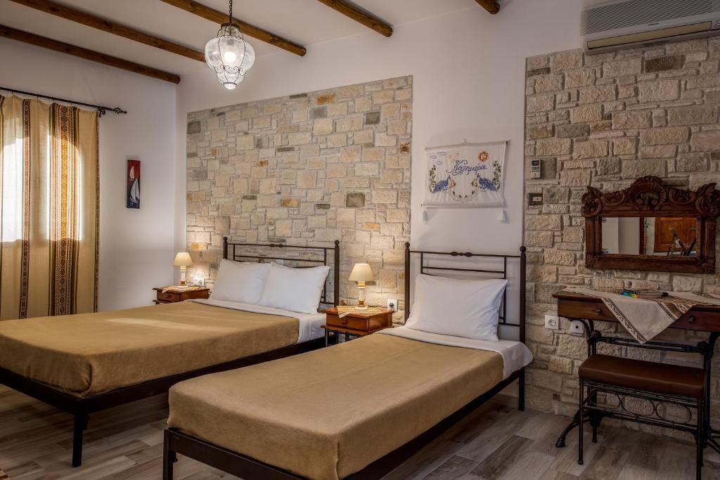 Postel nebo postele na pokoji v ubytování Cretan Villa Hotel