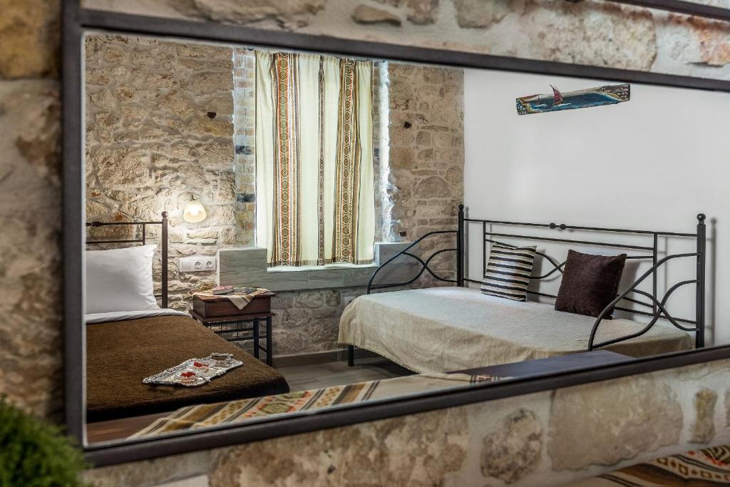 Postel nebo postele na pokoji v ubytování Cretan Villa Hotel